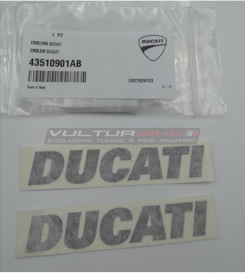 Par de emblemas originales Ducati color gris